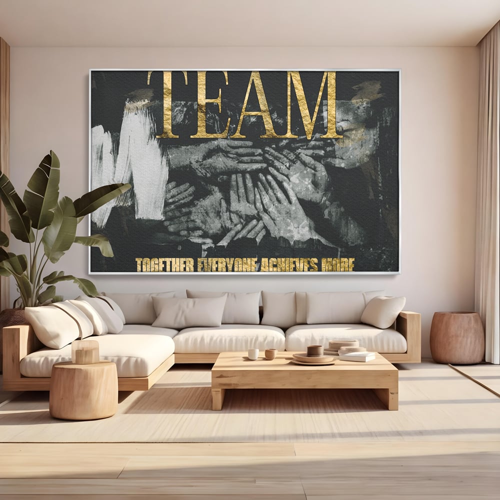 Tablou canvas cu tablou motivational cu maini si text, in rama de aluminiu argintiu, pe perete intr-un living